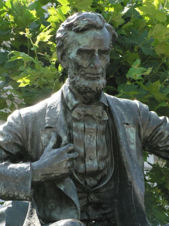 a close up of a statue of a person on his knees