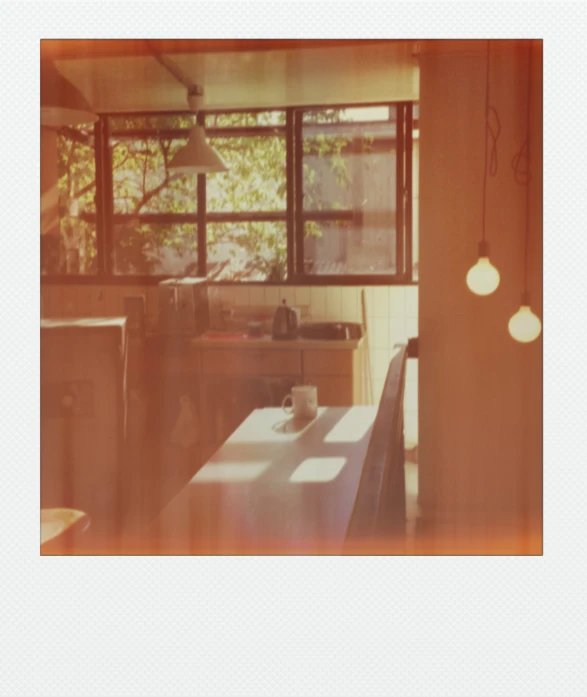 the interior of an apartment kitchen with a window and counter