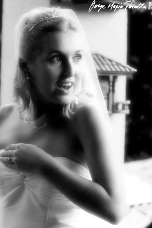 a beautiful blond bride in a white wedding dress