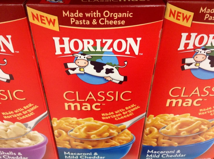 three boxes of horizon macaroni and cheese sitting in a line