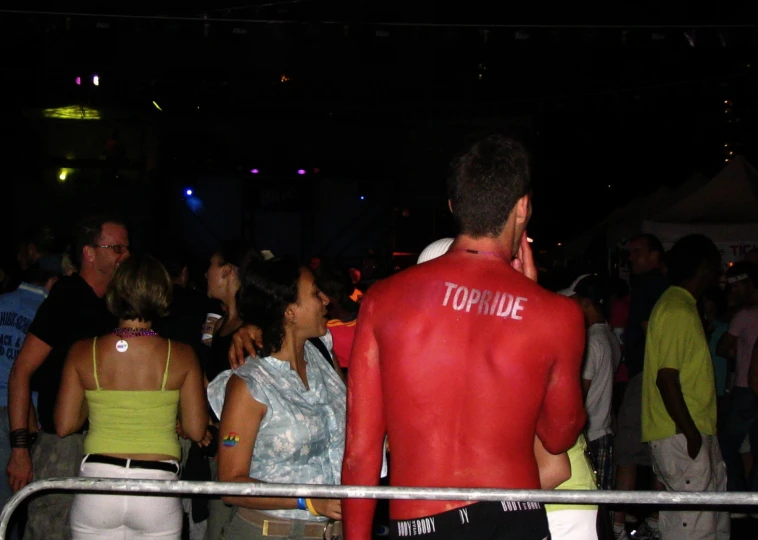 a man covered in a red plastic body paint