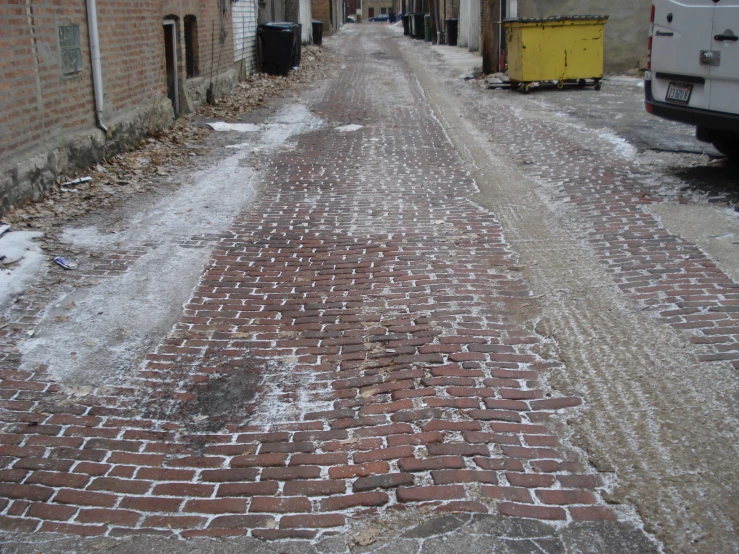 some very big pretty brick roads next to a white truck