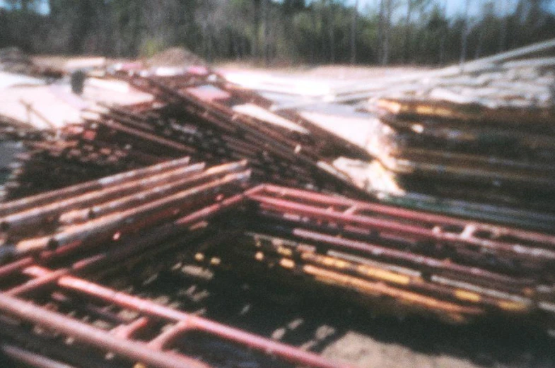 many steel beams are stacked in the pile