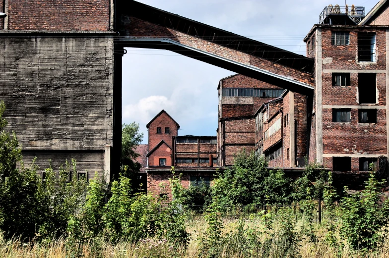 an image of an old factory in the middle of nowhere