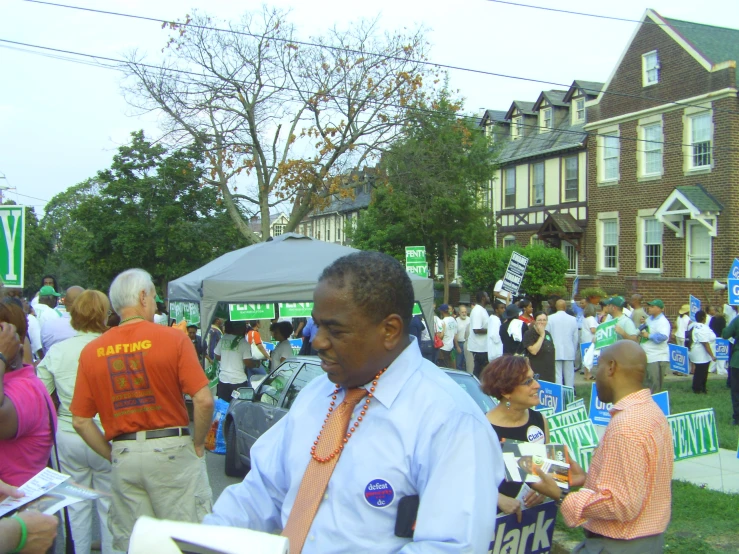 people with signs and flags in front of a building