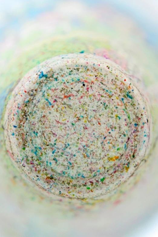 a bowl filled with sprinkles and colorful powder