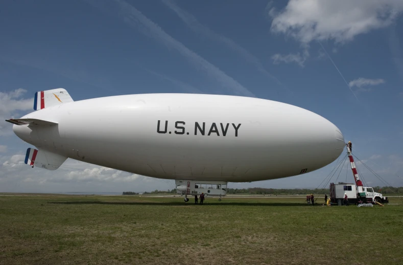 an u s navy blimf on display at a field