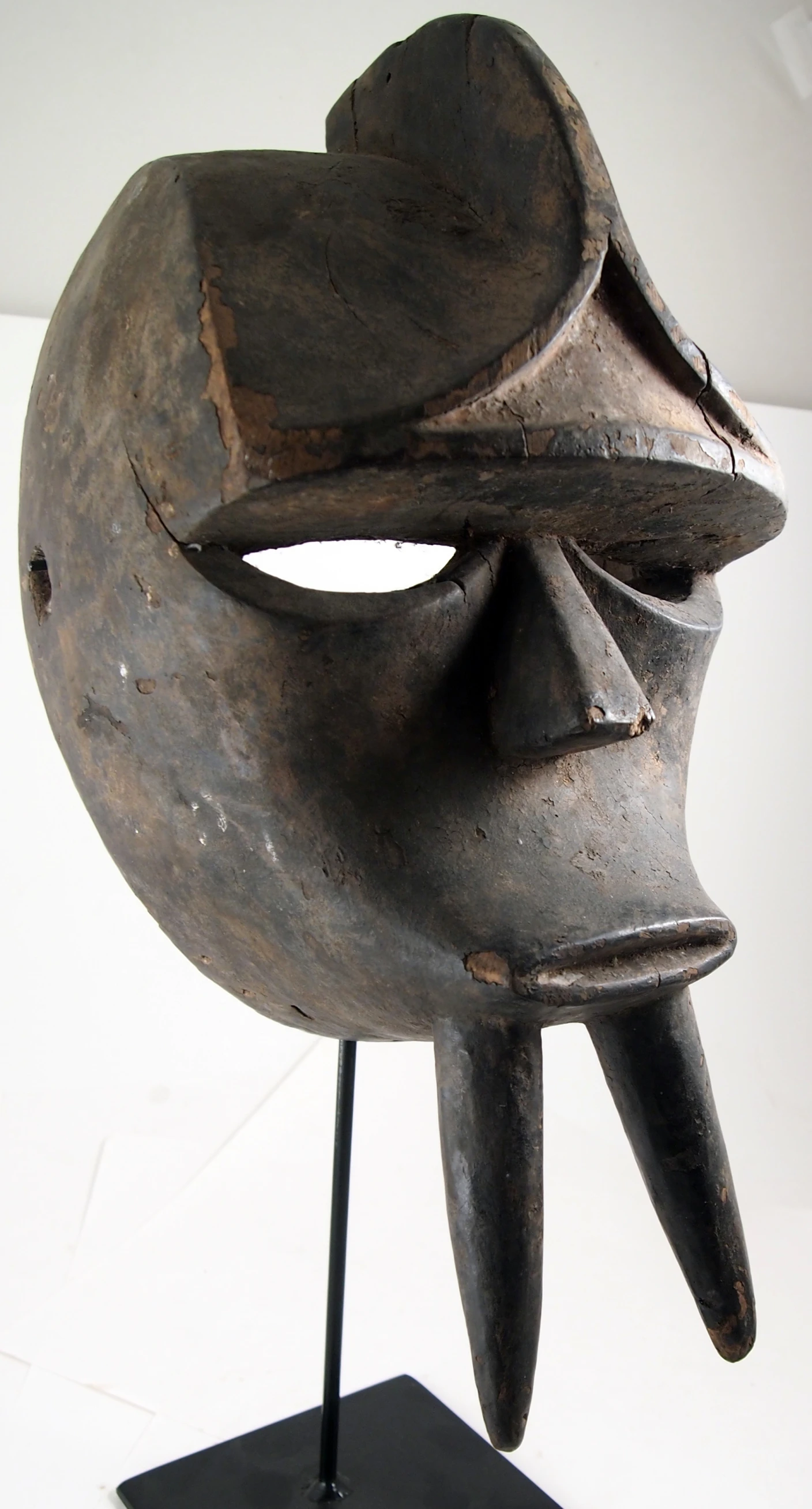 the mask has an extended, closed, open mouth