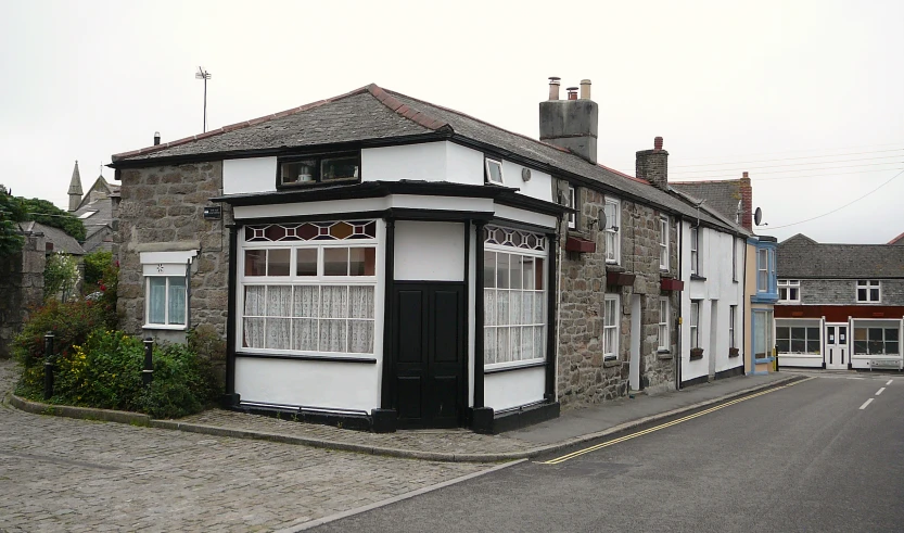 there is a very old building on the corner of a street