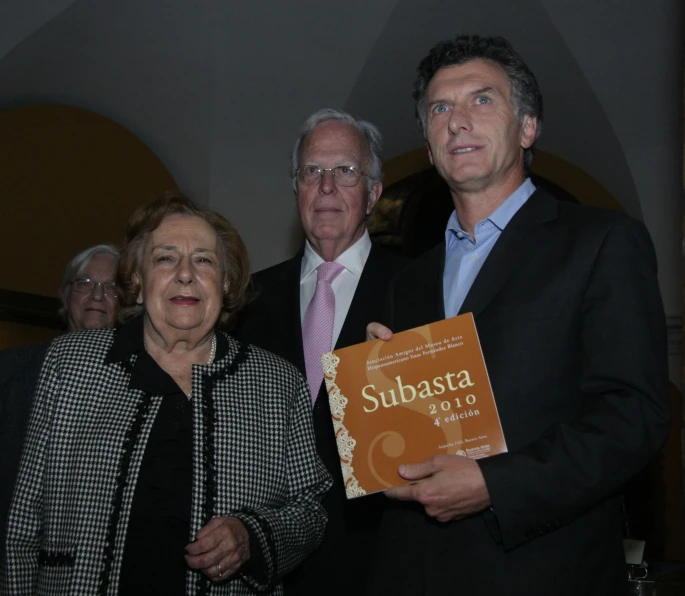 three people are holding an award for subbasta