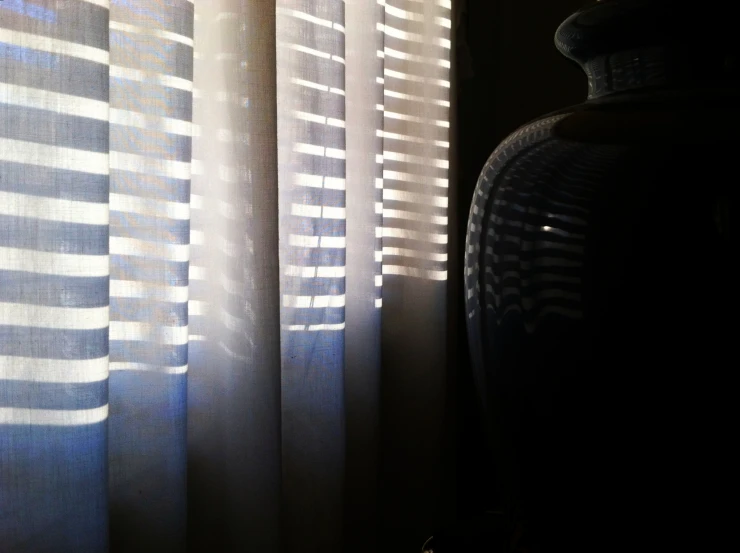 the light comes in through a thin curtain