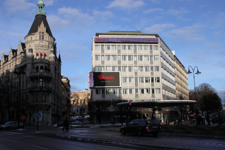 a busy street in a city with large buildings