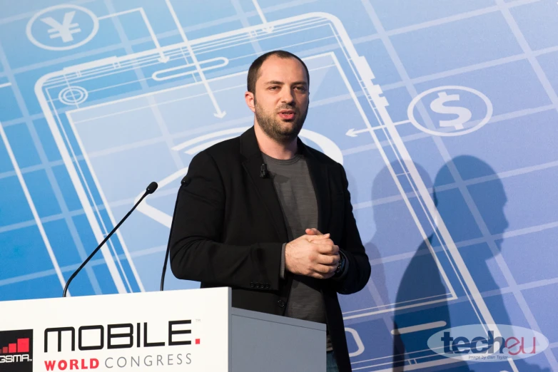 a man stands at a podium while speaking