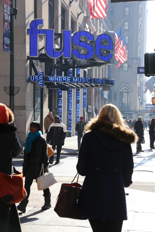 a woman walks down a street while her friends walk by