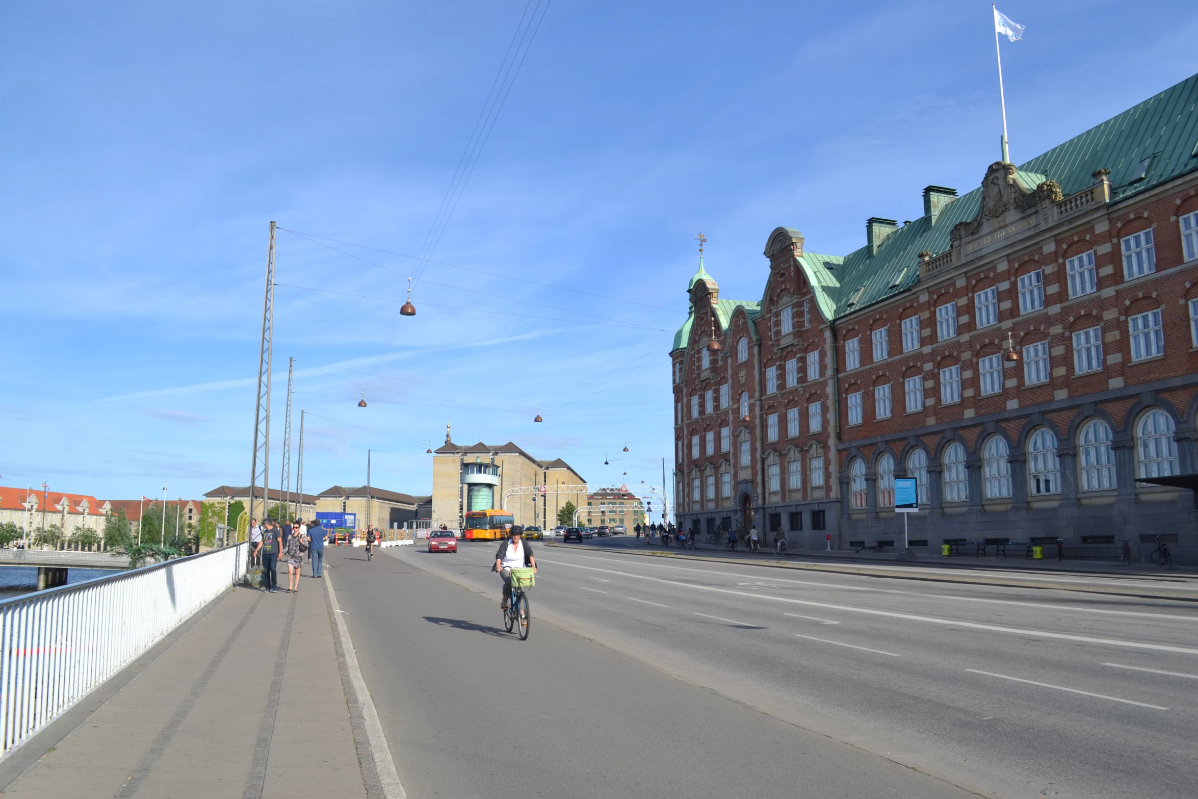 a street lined with tall buildings and tall towers