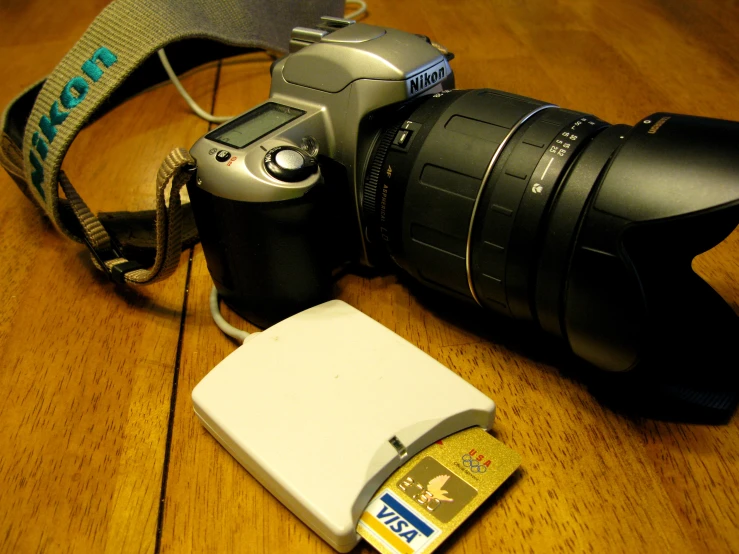 some electronics that is on a wooden table