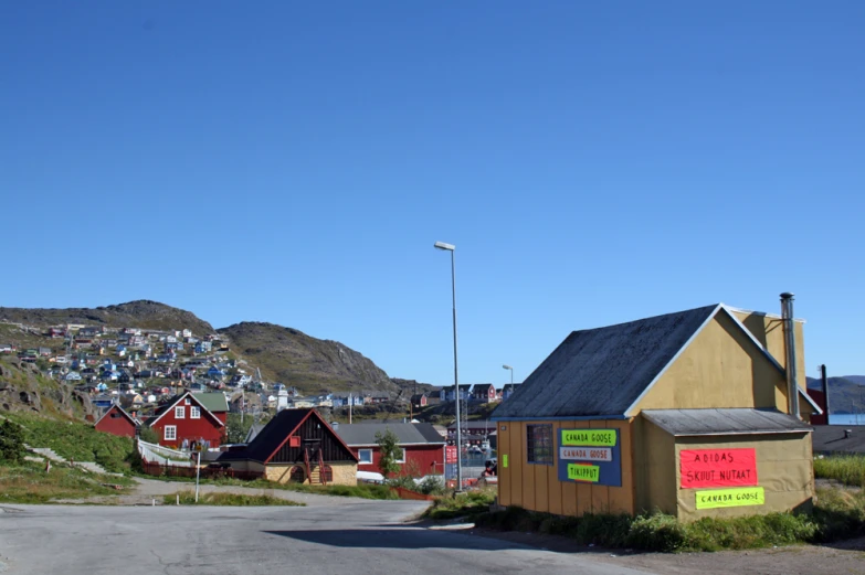 small houses with colorful buildings at the base of a mountain