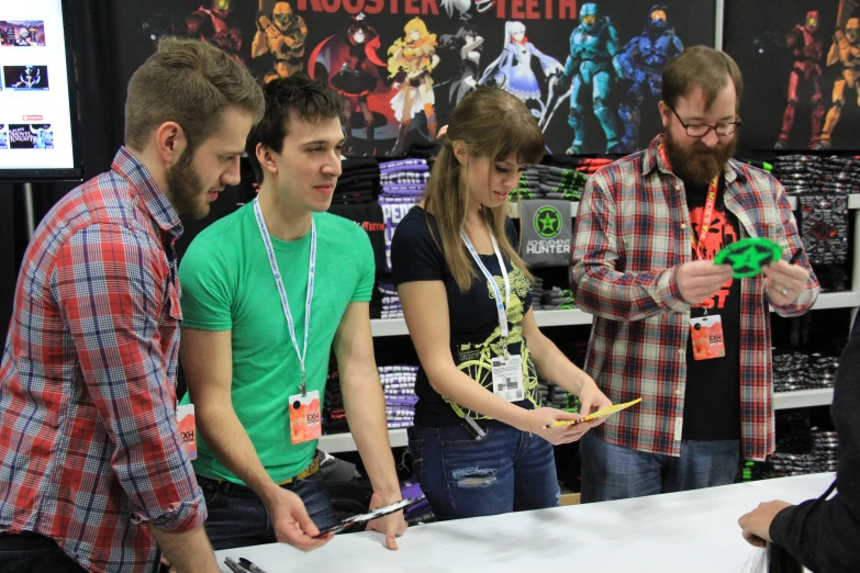 a group of people gathered around the counter