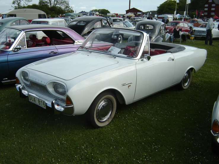 old fashion car parked in an antique show