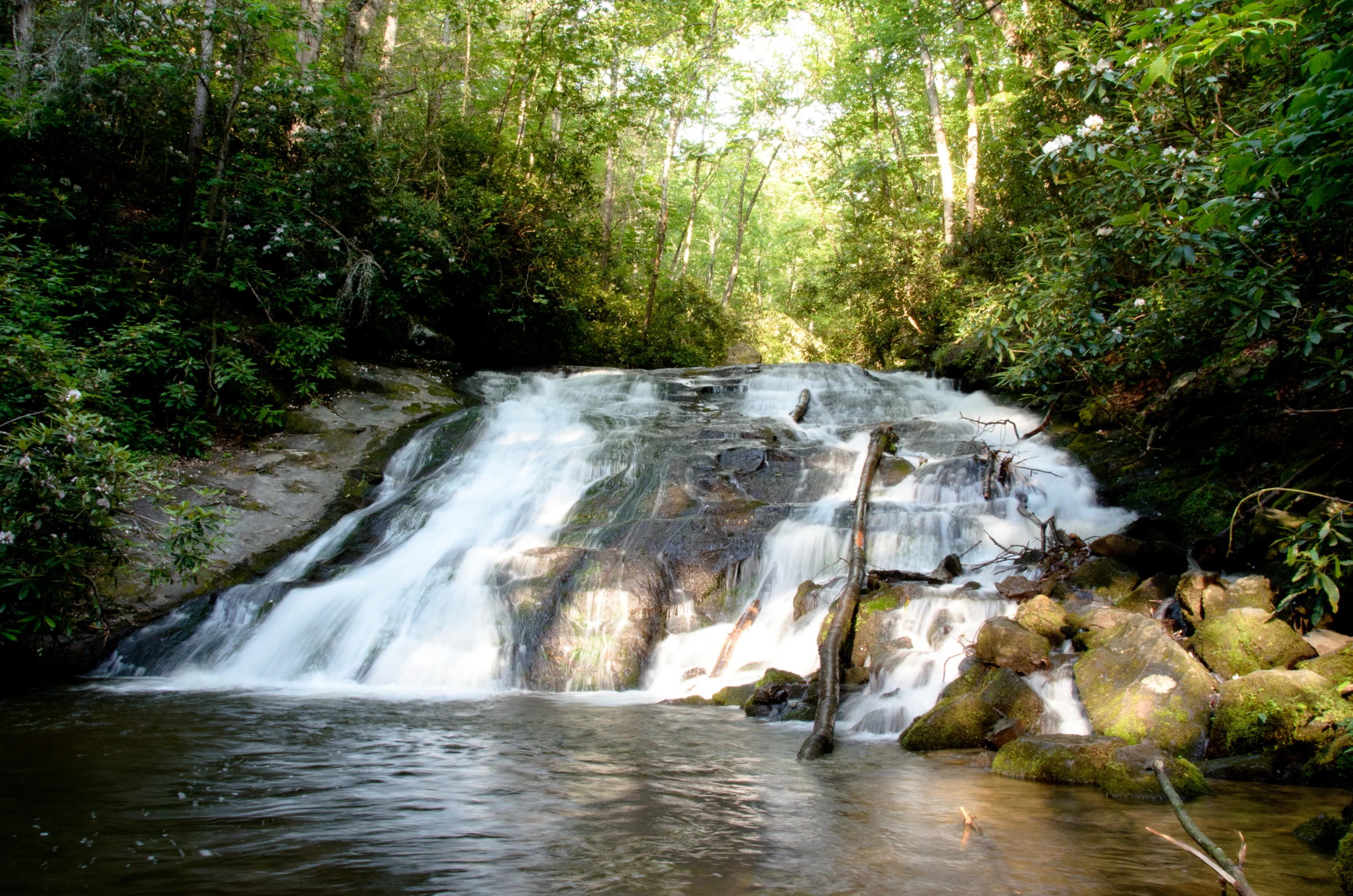 a waterfall with water flowing over it