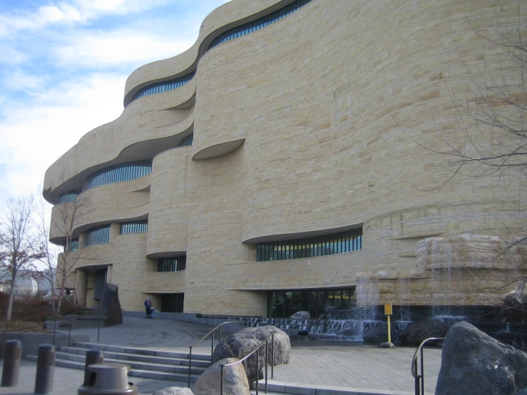 a building with many windows sits near stairs