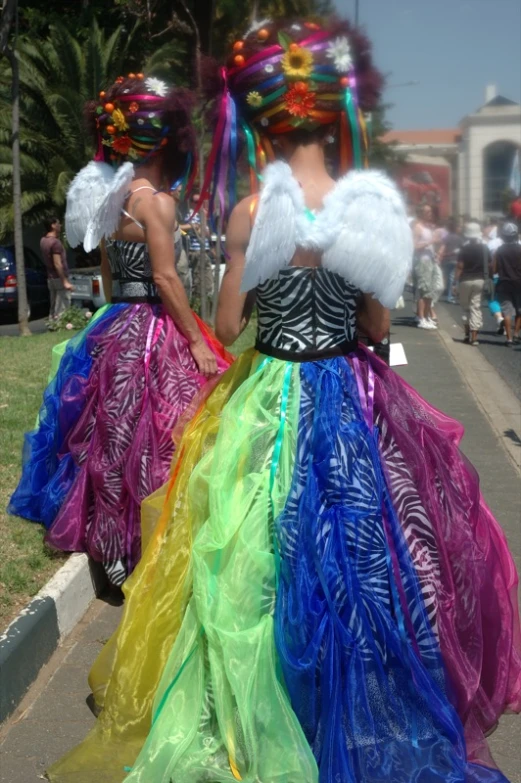 two ladies with colorful dress on walking together