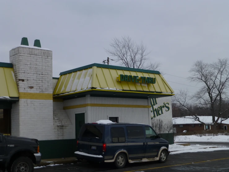 an exterior s of a green and white building