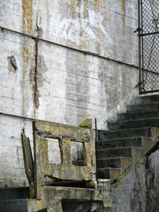 old set of steps against an unfinished wall