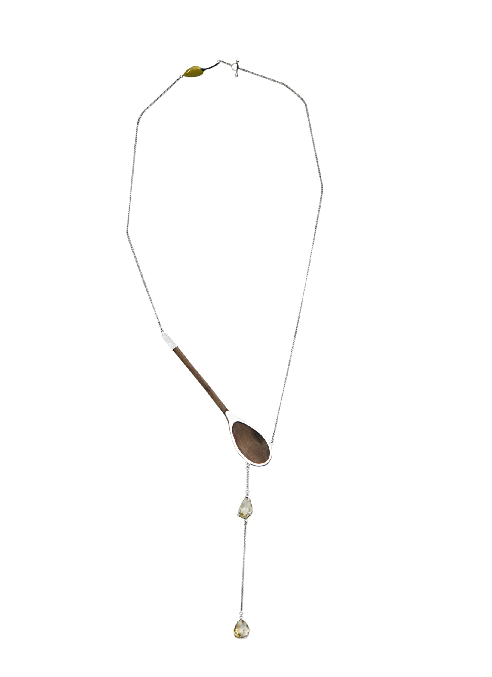 a necklace with a paddle, a bead and a rope