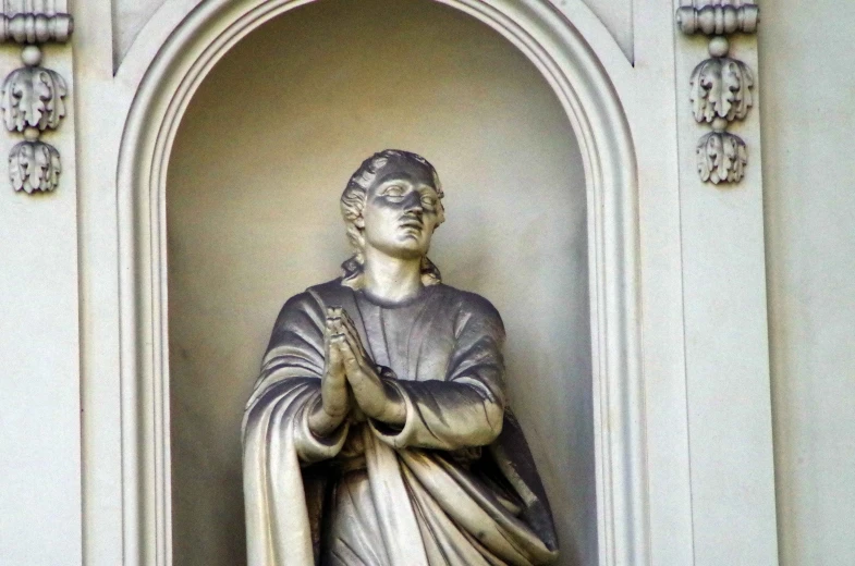 a statue of a woman in a white church