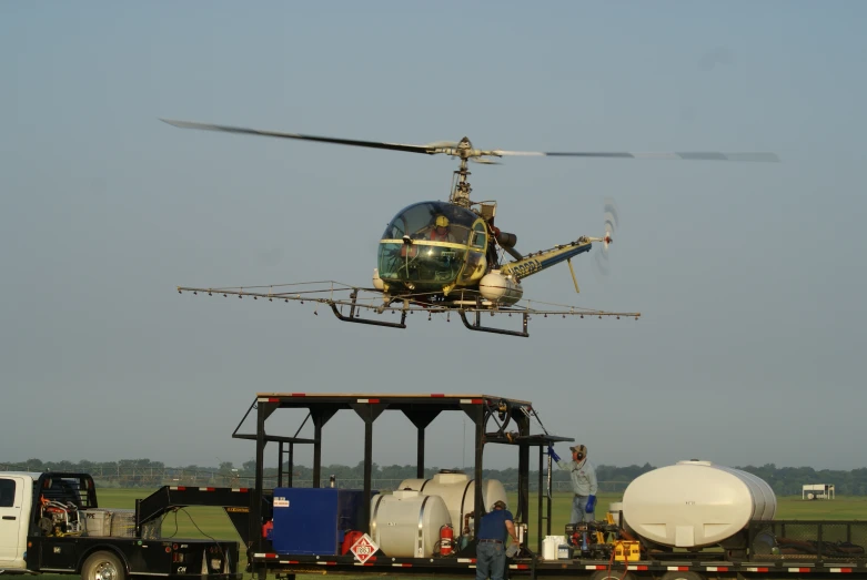 an air vehicle being towed by a helicopter