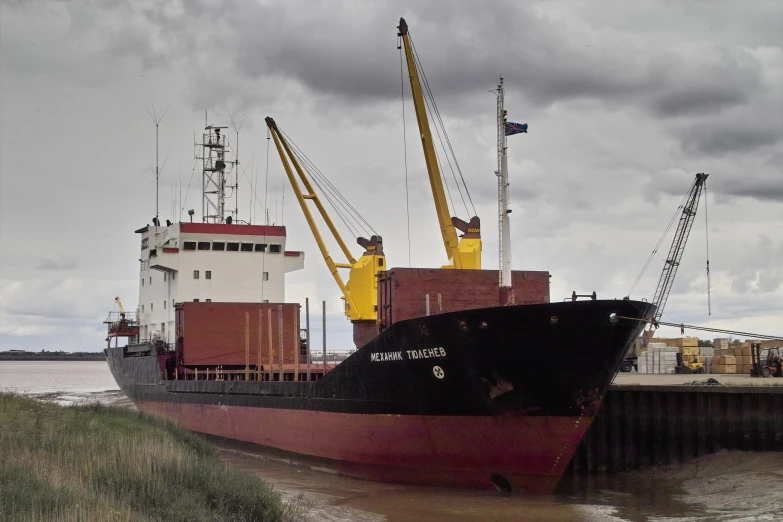 a ship is docked on the edge of a body of water