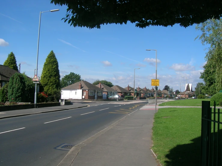 the empty street is lined with houses and houses