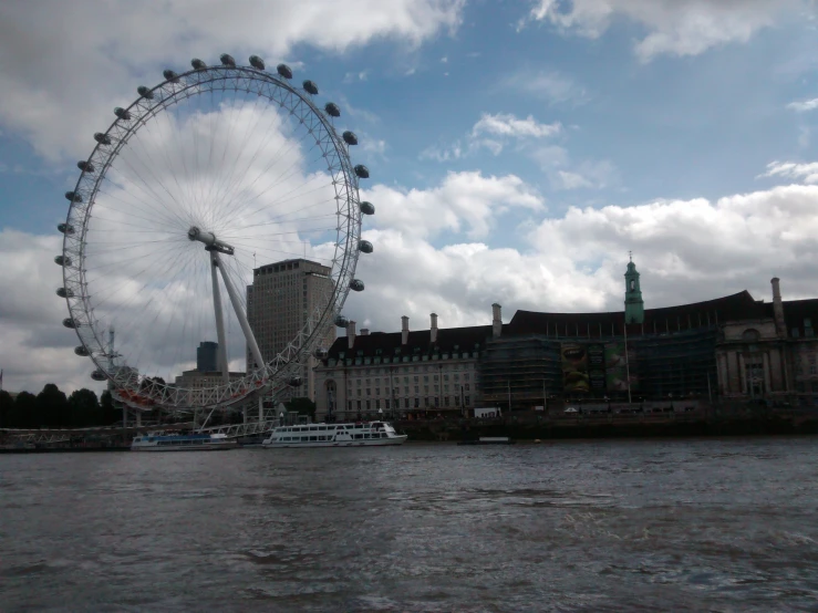 a big wheel in the middle of a river