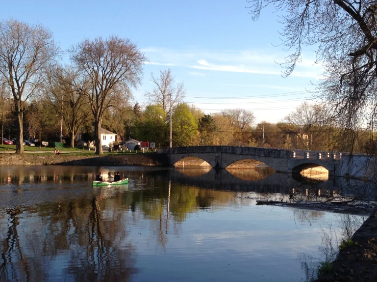 a bridge spanning over a river on a sunny day