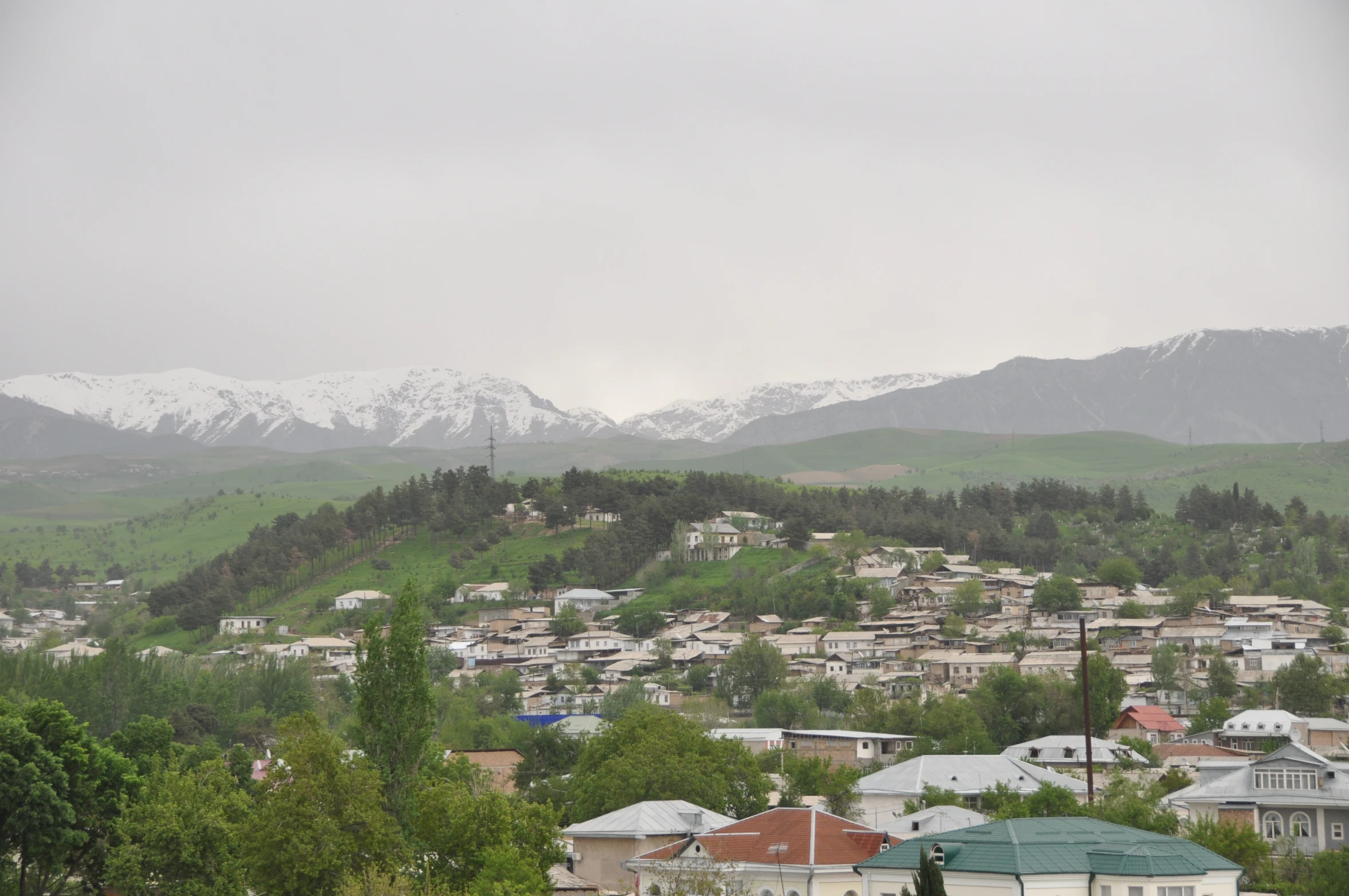 the city with a lot of houses on it with snow on the top of them