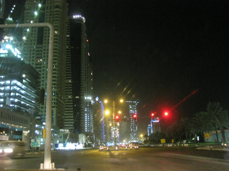 a nighttime view of a street in a big city