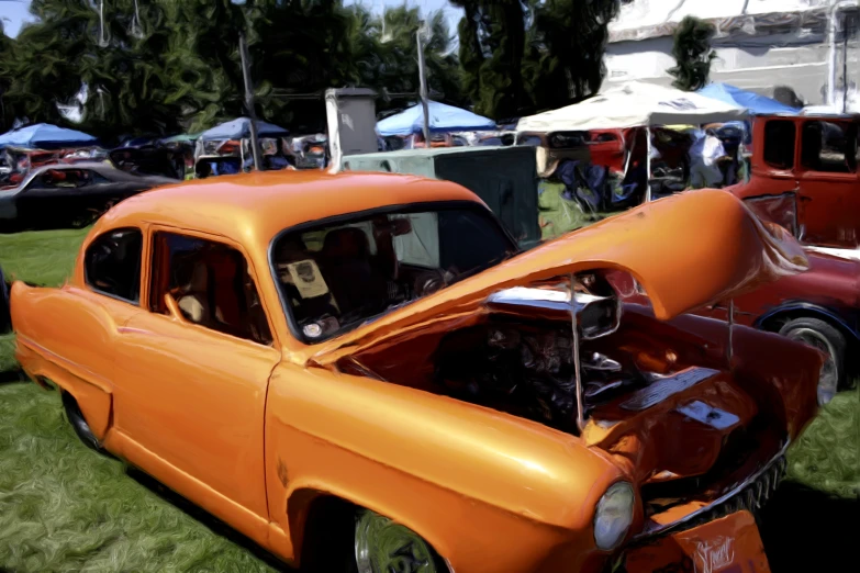 an orange car parked in the grass next to another orange car