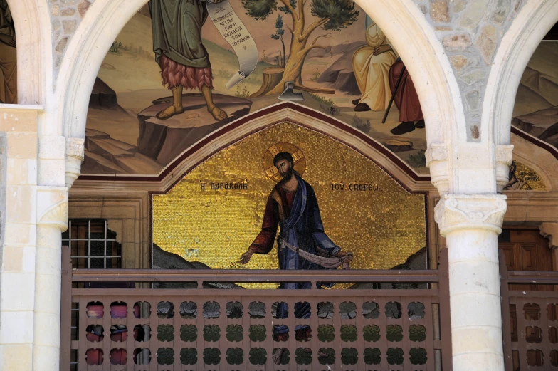 mosaic of jesus and angels above the doorway of a building