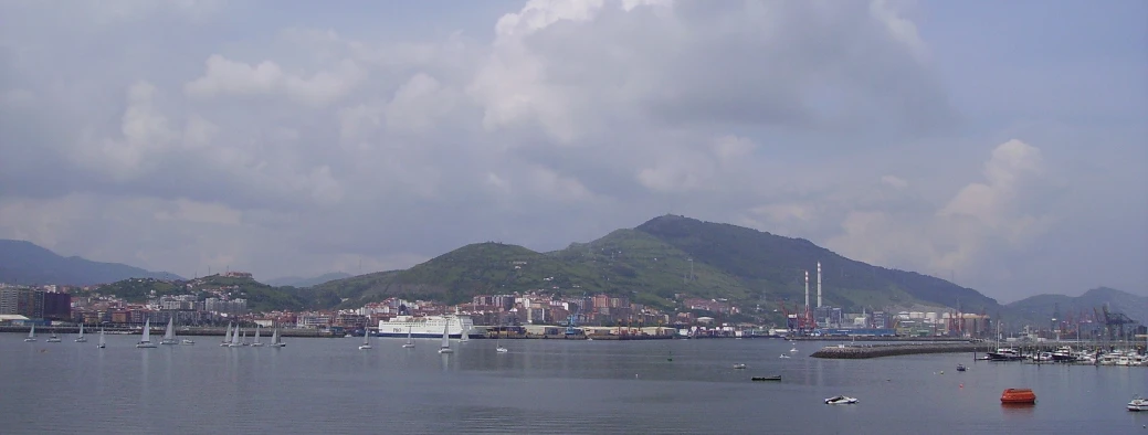 a po of boats in the water and mountains