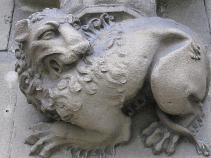 lion statue on the side of a building