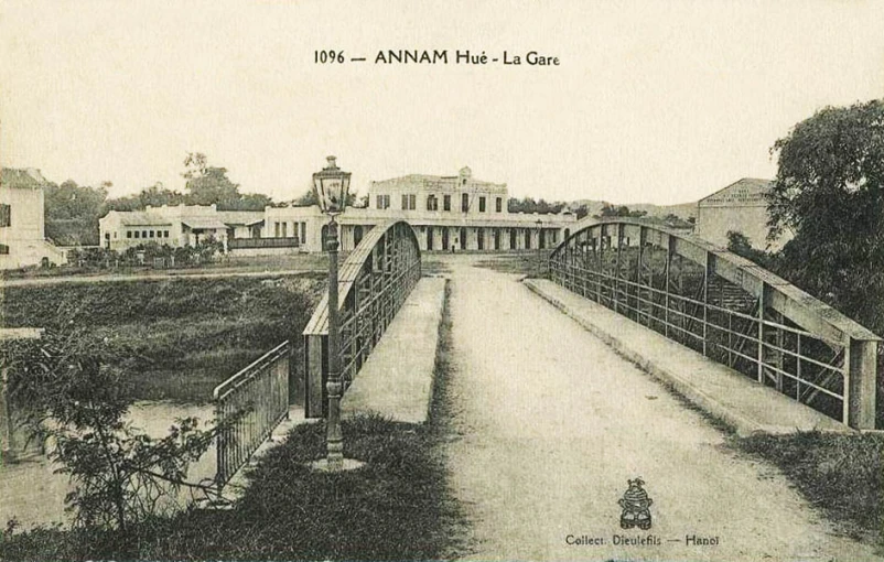 an old postcard with a bridge in the middle