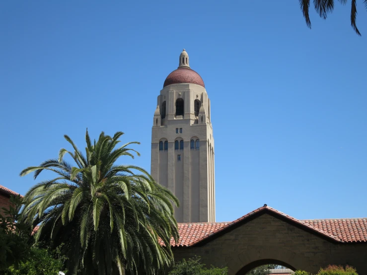 the dome of an old building stands out against a blue sky