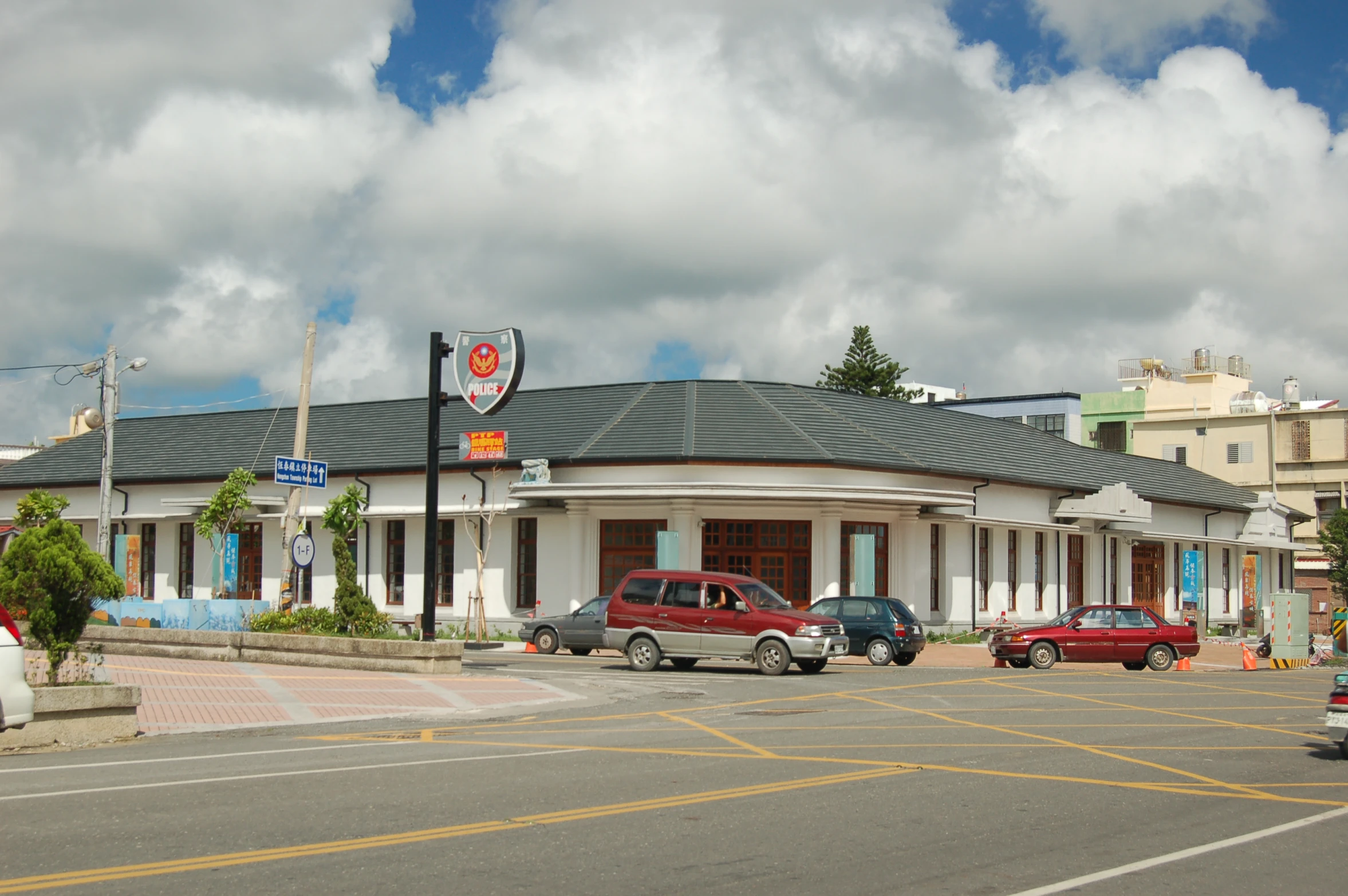 a restaurant with a large sign in front of it