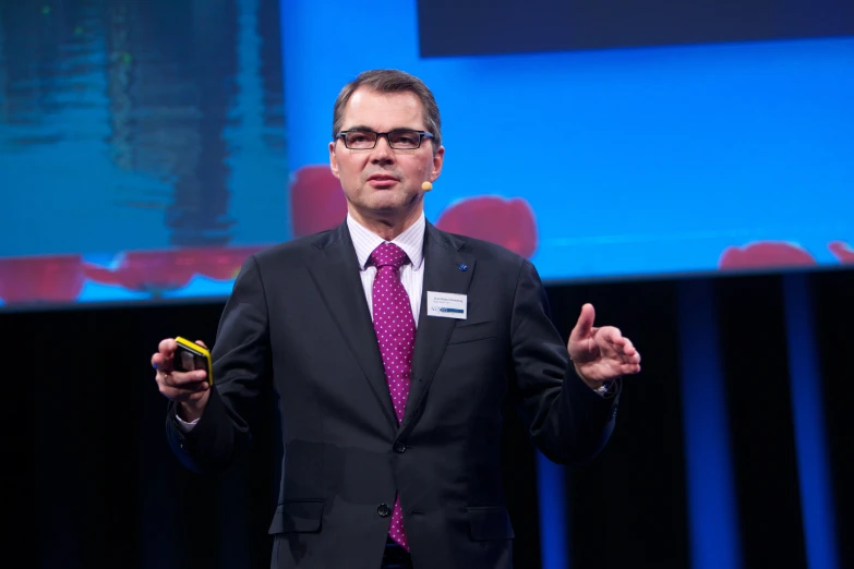 a man is talking with his hands and gesturing