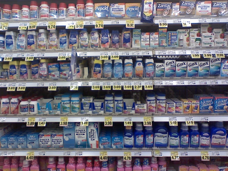 milk products are on display in a grocery store