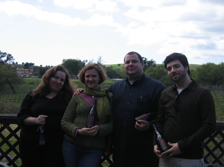 a group of people standing together in a park