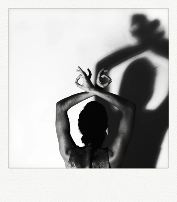 an image of a woman standing in the shadow