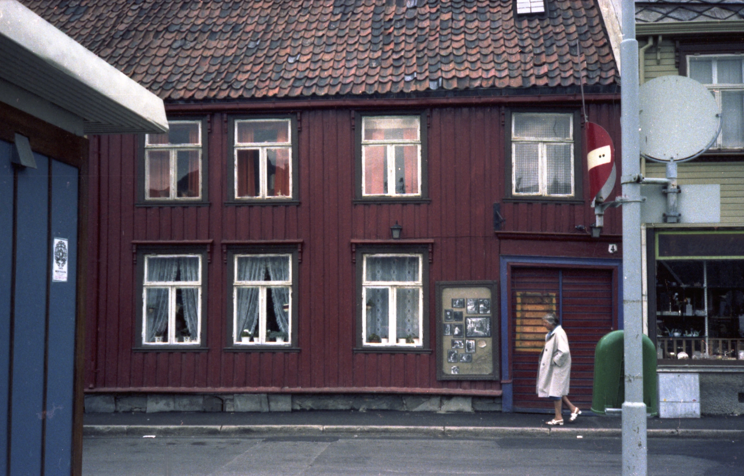 an older, brown building next to the street