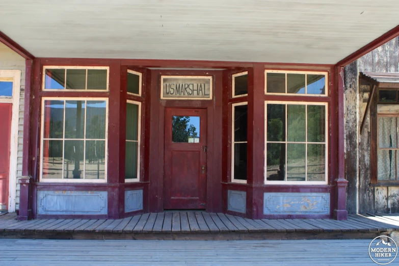 the front door of a small brick building